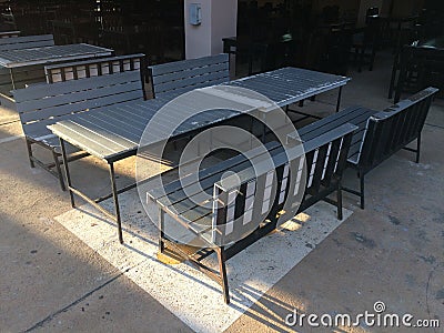 Table and benches under the building Stock Photo