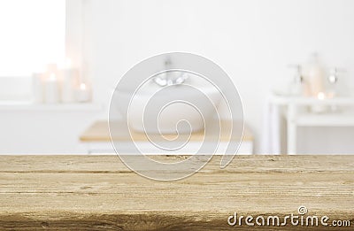 Table board before heavily blurred spa salon bathroom shelves background Stock Photo