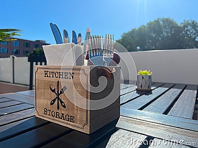 A table in a cafe or restaurant with napkins, forks, knives Stock Photo