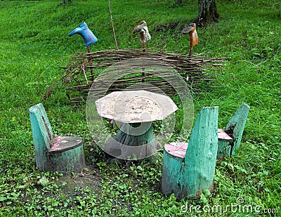 Table and chairs made of stumps and natural material Stock Photo