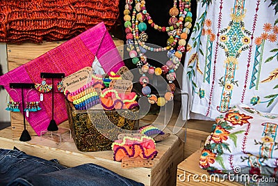 A table of clothing items on display in a store Editorial Stock Photo