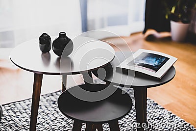 Table with decors a living room in a modern apartment for rent Stock Photo