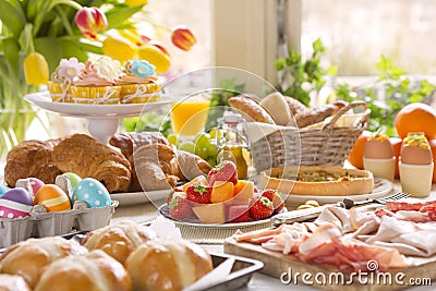 Table with delicatessen ready for Easter brunch Stock Photo