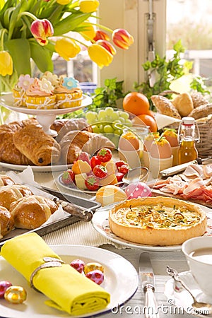 Table with delicatessen ready for Easter brunch Stock Photo