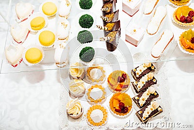 Table with different sweets for party. Candy bar. Stock Photo