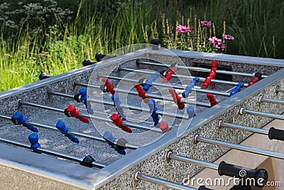 Table football stands outdoors. Foosball table stands at the public place Stock Photo