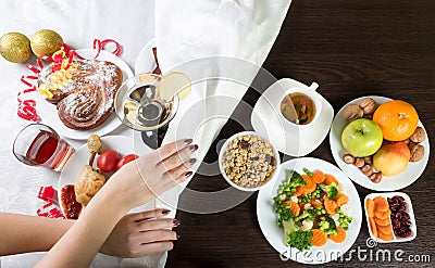 Table with healthy and unhealthy food and alcohol. Dieting after Ð¡hristmas Stock Photo