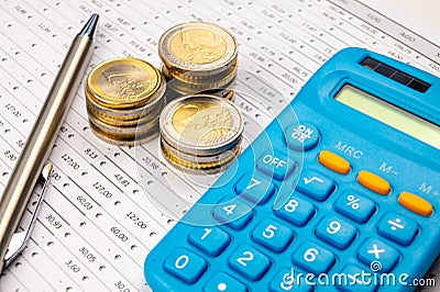 Table with numbers, Euro amounts, calculator, and money. Stock Photo