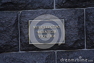 Table with the inscription Ministry of Finance of Ukraine in the Ukrainian language on the wall of a government building. Kiev Editorial Stock Photo