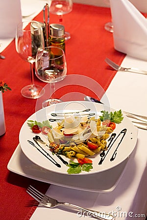 Table with Italian pasta in restaurant Stock Photo