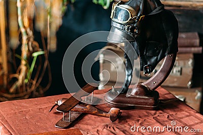 on the table lies the pilot's helmet, a toy airplane made of wood Stock Photo