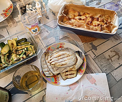 Table prepared with food cake satata speck and cherry tomatoes Stock Photo