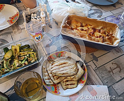 Table prepared with food cake satata speck and cherry tomatoes Stock Photo