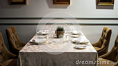 Table in restaurant or bar closeup. Classic interior of cozy cafe with a served table Stock Photo