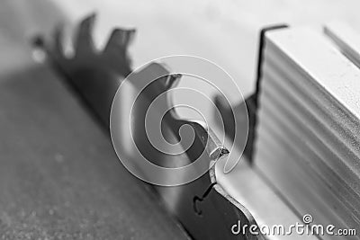 Table saw blade tooth close up macro shot Stock Photo