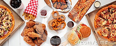 Table scene of assorted take out or delivery foods, top down view on a white wood banner Stock Photo