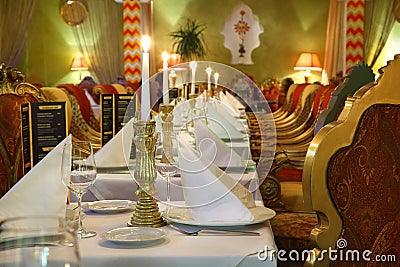 Table with serving and chairs in luxury restaurant Stock Photo