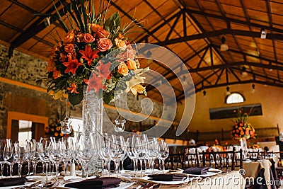 Table setup, wedding guest table, reception layout in pantone living coral Stock Photo