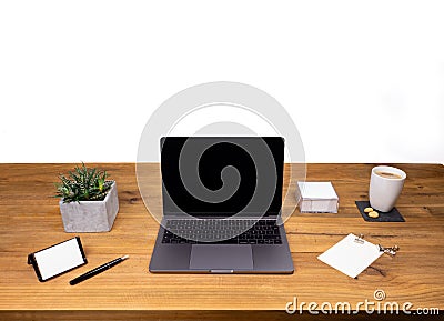 Table shot desk view with pencil a plant, coffee, workspace, business, laptop and notes Stock Photo