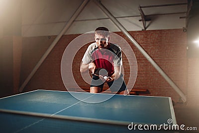 Table tennis, male player with racket and ball Stock Photo