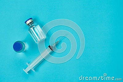 Table top view accessories healthcare & medical with coronavirus background concept.Anti retroviral vaccine bottle with Syringe on Stock Photo