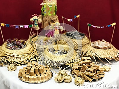 Table of typical food of junina party: paÃ§oca candy, lollipops, cake, dulce de leche, peanut candy. Tradicional Festa Junina Stock Photo