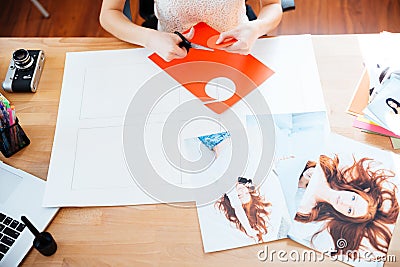 Table of woman photographer making collage with photos Stock Photo