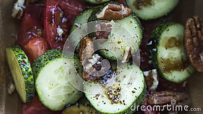 On the table in a wooden, deep plate prepared green salad Stock Photo