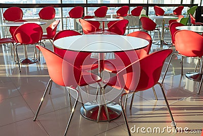 Tables and chairs in an empty cafe, office, coworking or room. Stylish design, vintage style. Closed restaurant, isolation due to Stock Photo