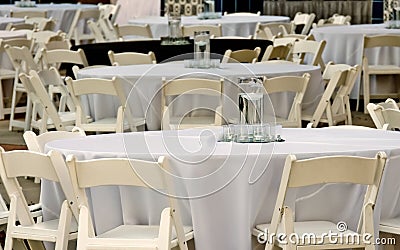 Tables and chairs for evening event Stock Photo