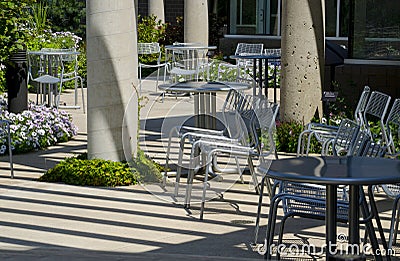 Tables and chairs in the garden Stock Photo
