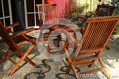 Tables and chairs in a small restaurant.outdoor cafe. sitting wooden folding armchair Stock Photo