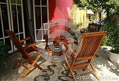 Tables and chairs in a small restaurant.outdoor cafe. sitting wooden folding armchair Stock Photo
