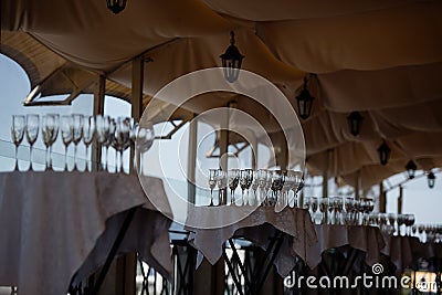 on tables are clean glass bakery, blue sky in the background, a terrace in the restaurant Stock Photo