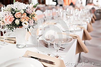 Tables set for an event party or wedding reception. luxury elegant table setting dinner in a restaurant. glasses and Stock Photo