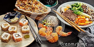 Tables spread with traditional Japanese cuisine Stock Photo