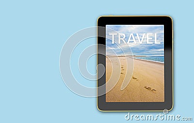 Tablet with beach scene on display - Footsteps in the sand Stock Photo