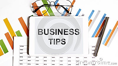 The tablet with BUSINESS TIPS on a chart Stock Photo
