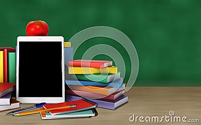 Tablet, colorful books, school supplies and apple on the table o Stock Photo