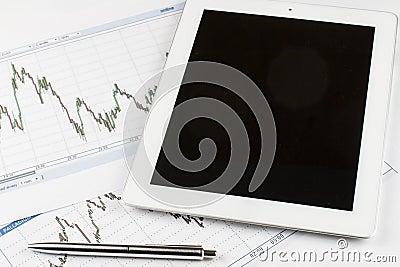 Tablet computer, Blueprints and silver pen on a white background, business concept. Stock Photo