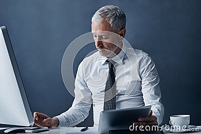 Tablet, computer and business man in office online for social media, internet and browse website at desk. Networking Stock Photo