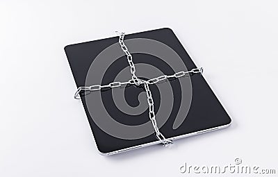 A tablet computer tied to a chain Stock Photo