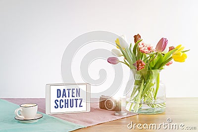 Tablet with Datenschutz writing in german meaning data privacy i Stock Photo