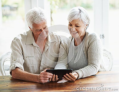 Tablet, happy senior couple and online in house with social media, reading news app and ebook. Retirement, old man and Stock Photo
