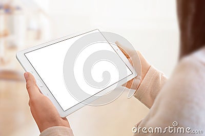 Tablet mockup closeup. White tablet in woman hands Stock Photo