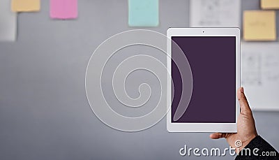 Tablet Mockup Image. Display Screen is Clipping Path. Modern Businesman Using Tablet in Office. Blurred Sticky Note and Project Stock Photo