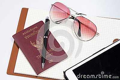 Tablet with notebook passport Stock Photo