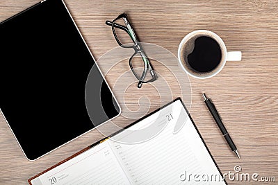 Tablet, notepad, glasses and coffee cup Stock Photo