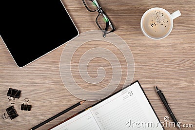 Tablet, notepad, glasses and coffee cup Stock Photo