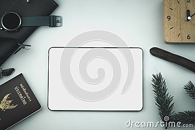 Tablet and passport with many item in vacation season to plan travel in holiday Stock Photo